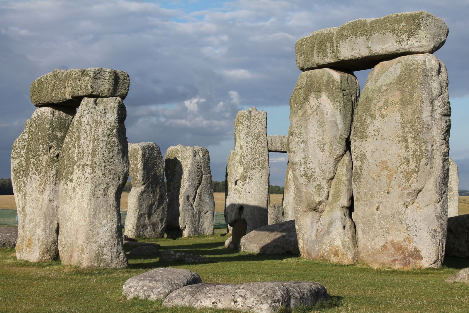 The standing stones of Stonehenge under a dramatic sky
